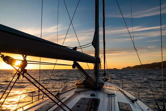 yacht-sailing-at-sunset-during-a-storm-luxury-vac-2026-03-16-22-44-54-utc